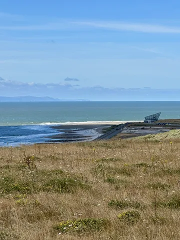 The coastline seen from the grassy ground at Aberthaw.