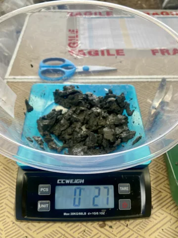 A portion of sample material on a digital balance.