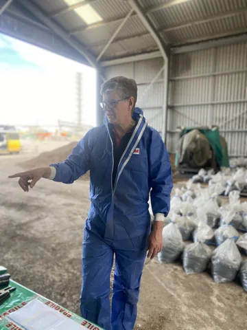 A team member in the workspace where the bagged samples are prepared.